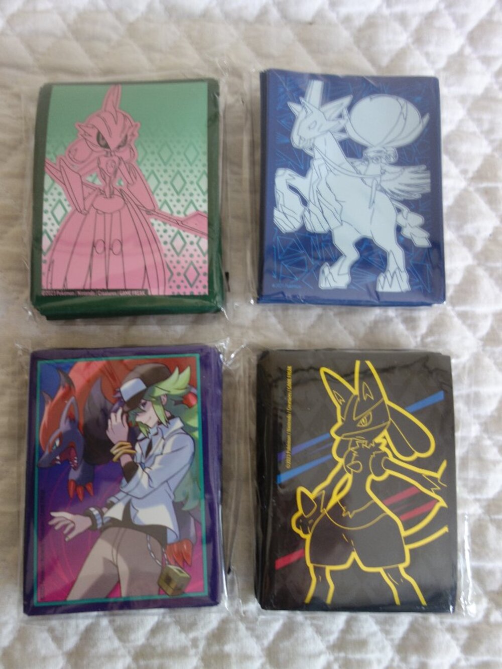 (d)	Lot of 4 NIP 65 count ea POKEMAN Trading Card Sleeves